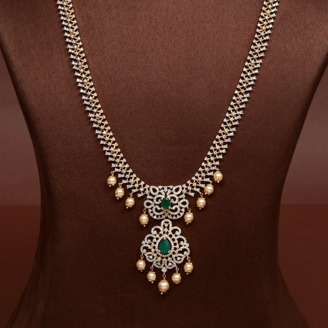 Close-up of Hriday collection of  92.5 silver Victorian-style long necklace with CZ stones, intricate floral motifs, and pendant design for bridal and festive wear by Sri Fine Jewellery, Hyderabad.