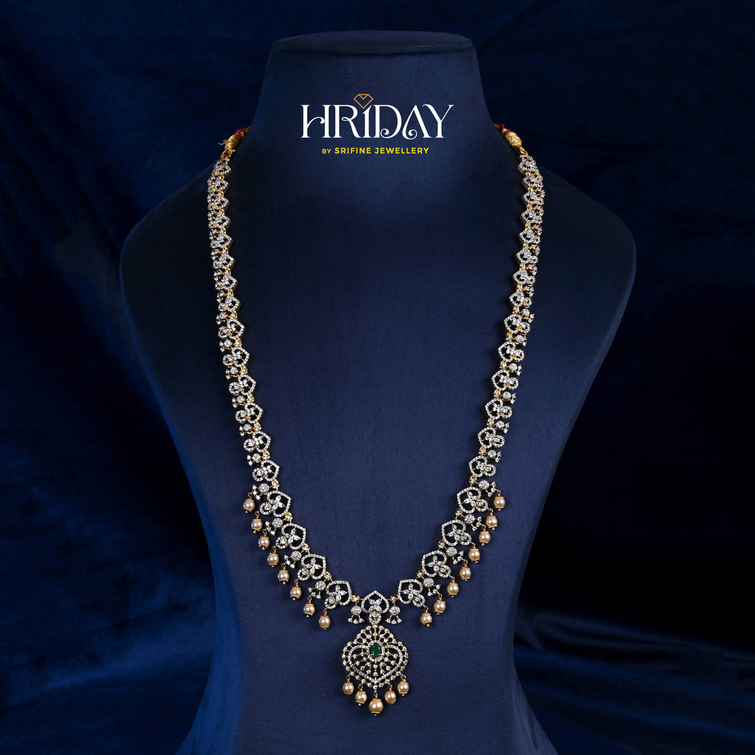 Hriday collection of 92.5 silver long necklace with CZ stones, intricate floral motifs, and pendant design for bridal and festive wear by Sri Fine Jewellery, Hyderabad.