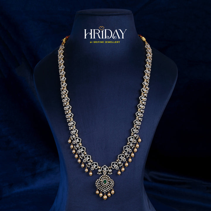 Hriday collection of 92.5 silver long necklace with CZ stones, intricate floral motifs, and pendant design for bridal and festive wear by Sri Fine Jewellery, Hyderabad.