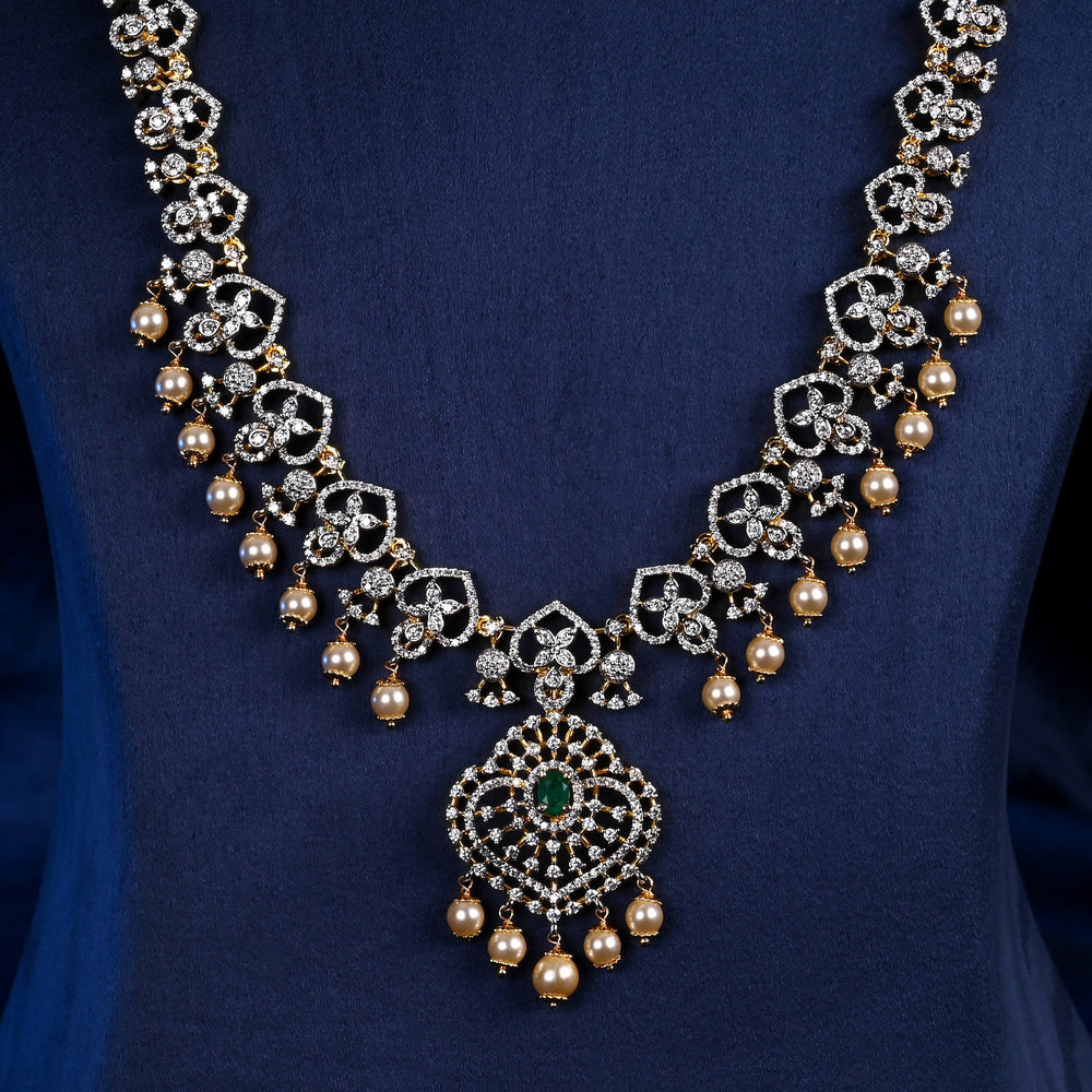 Close-up of Hriday collection of 92.5 silver long necklace with CZ stones, intricate floral motifs, and pendant design for bridal and festive wear by Sri Fine Jewellery, Hyderabad.
