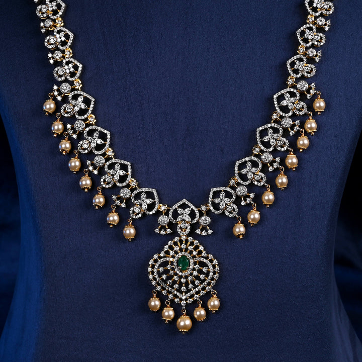 Close-up of Hriday collection of 92.5 silver long necklace with CZ stones, intricate floral motifs, and pendant design for bridal and festive wear by Sri Fine Jewellery, Hyderabad.