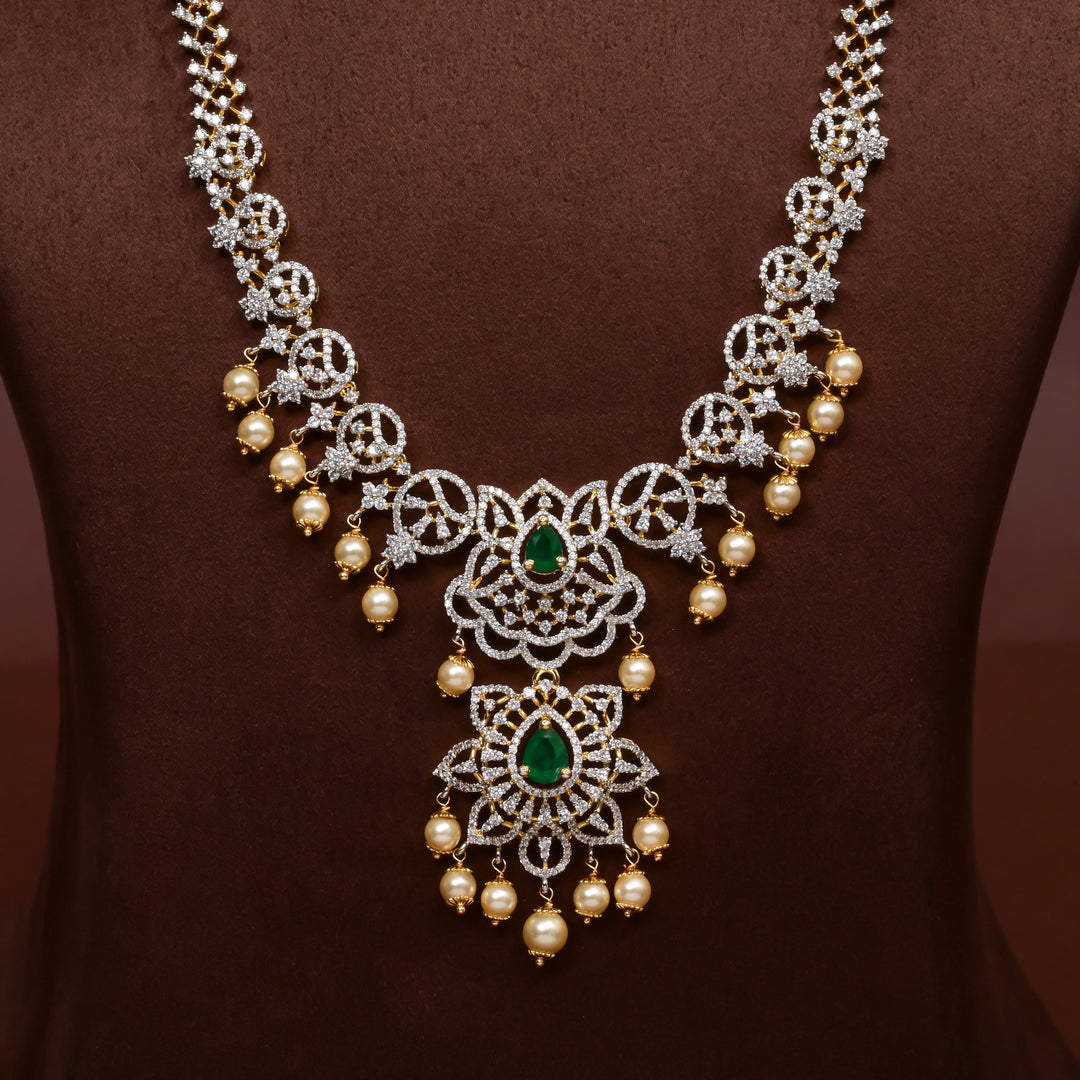 Close-up of Hriday collection of 92.5 silver long necklace with CZ stones, intricate floral motifs, and pendant design for bridal and festive wear by Sri Fine Jewellery, Hyderabad.