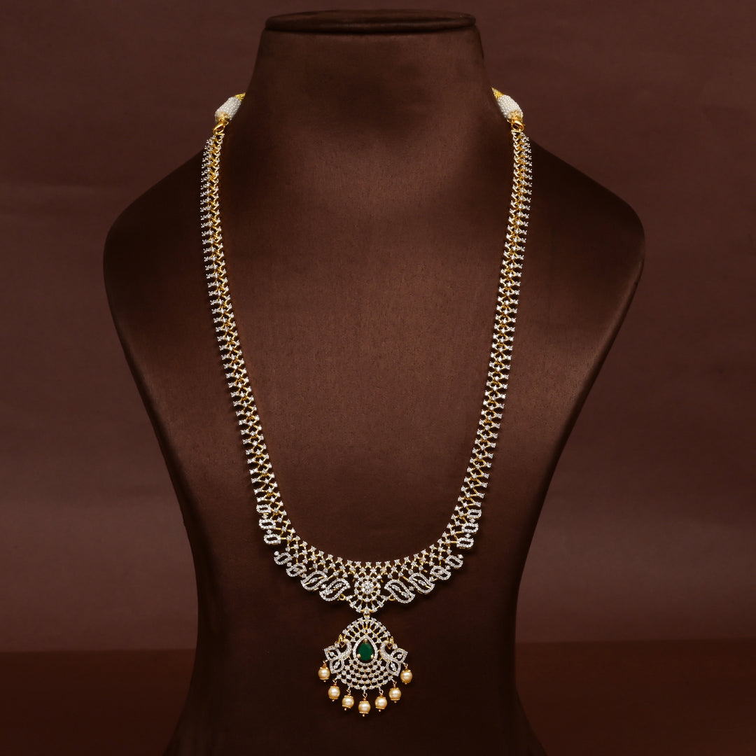 Luxury diamond-look silver cz emerald necklace with premium cz stones, semi-precious emerald stone and  pearl drops in 92.5 silver, bridal wedding jewellery with gold finish by Sri Fine Jewellery Punjagutta Hyderabad.