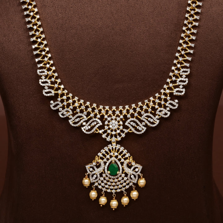 Luxury diamond-look silver cz emerald necklace with premium cz stones, semi-precious emerald stone and  pearl drops in 92.5 silver, bridal wedding jewellery with gold finish by Sri Fine Jewellery Punjagutta Hyderabad.