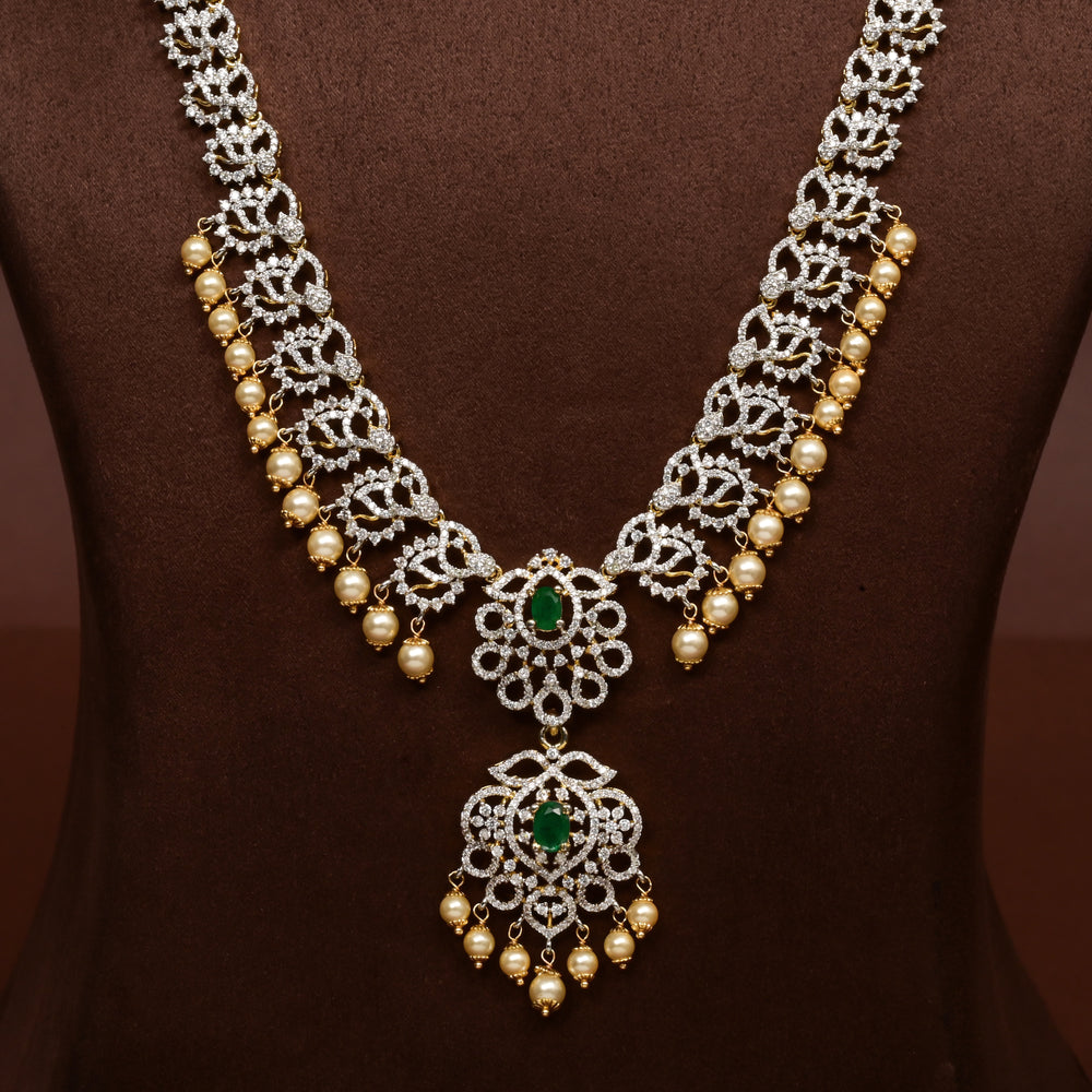 Close-up of Hriday collection of 92.5 silver long necklace with CZ stones, intricate floral motifs, and pendant design for bridal and festive wear by Sri Fine Jewellery, Hyderabad.