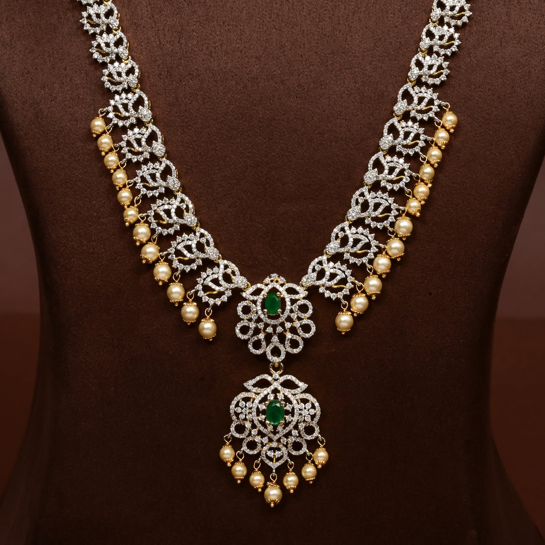Close-up of Hriday collection of 92.5 silver long necklace with CZ stones, intricate floral motifs, and pendant design for bridal and festive wear by Sri Fine Jewellery, Hyderabad.