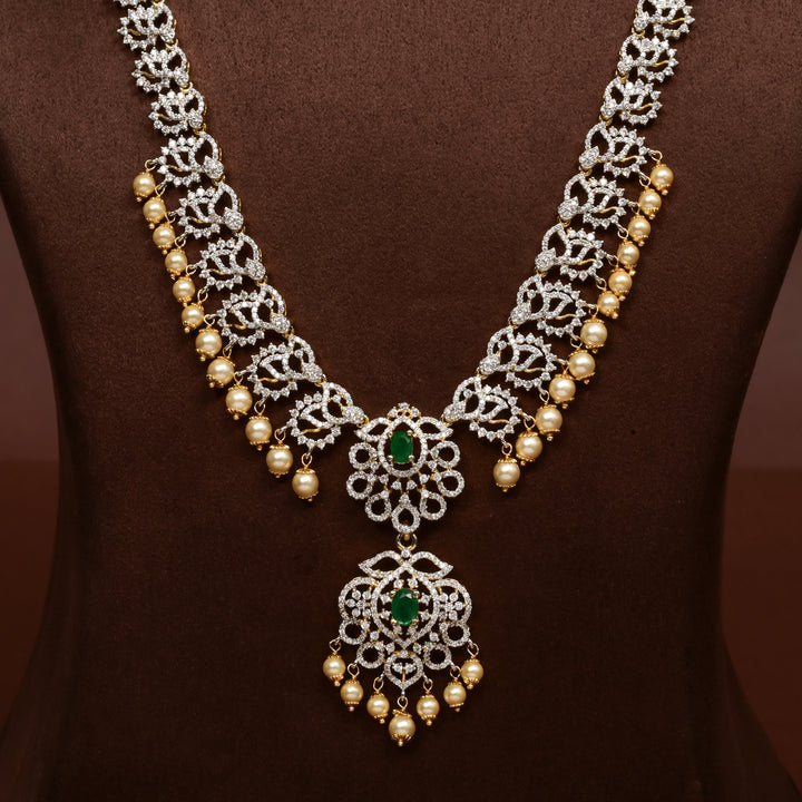 Close-up of Hriday collection of 92.5 silver long necklace with CZ stones, intricate floral motifs, and pendant design for bridal and festive wear by Sri Fine Jewellery, Hyderabad.