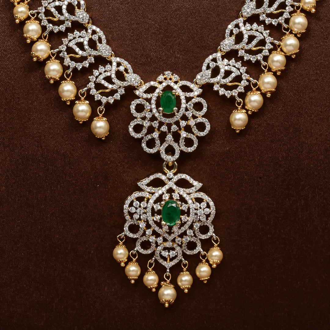 Close-up of Hriday collection of 92.5 silver long necklace with CZ stones, intricate floral motifs, and pendant design for bridal and festive wear by Sri Fine Jewellery, Hyderabad.