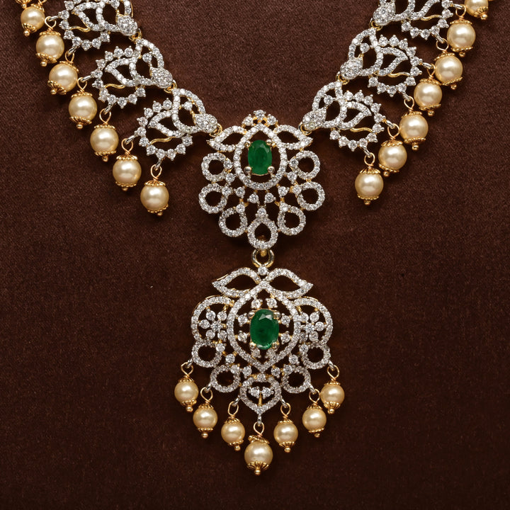 Close-up of Hriday collection of 92.5 silver long necklace with CZ stones, intricate floral motifs, and pendant design for bridal and festive wear by Sri Fine Jewellery, Hyderabad.