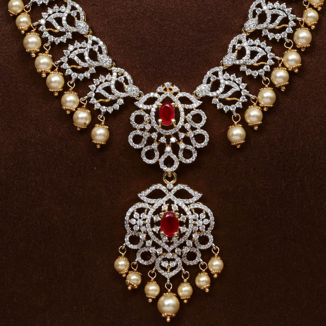 Close-up of Hriday collection of 92.5 silver long necklace with CZ stones, intricate floral motifs, and pendant design for bridal and festive wear by Sri Fine Jewellery, Hyderabad.