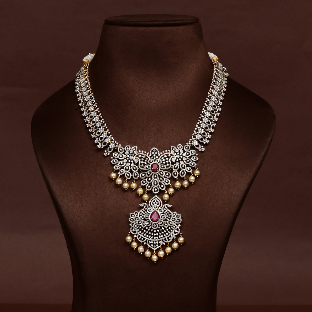 Hriday collection of 92.5 silver necklace with CZ stones, intricate floral motifs, and pendant design for bridal and festive wear by Sri Fine Jewellery, Hyderabad.