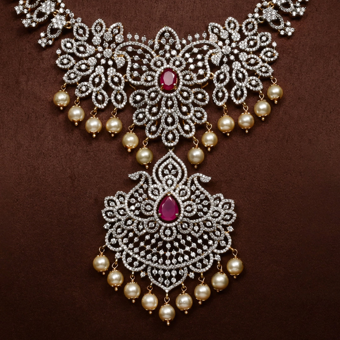 Close-up of Hriday collection of 92.5 silver necklace with CZ stones, intricate floral motifs, and pendant design for bridal and festive wear by Sri Fine Jewellery, Hyderabad.