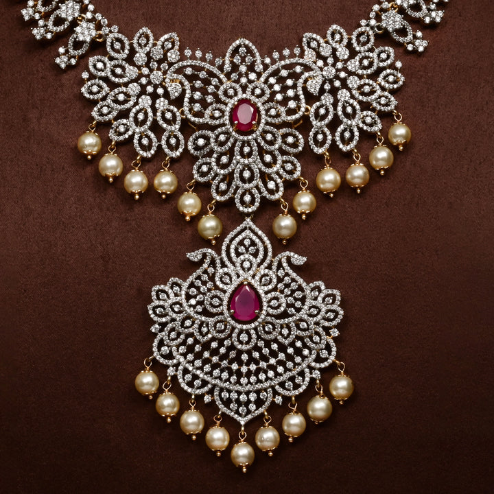 Close-up of Hriday collection of 92.5 silver necklace with CZ stones, intricate floral motifs, and pendant design for bridal and festive wear by Sri Fine Jewellery, Hyderabad.