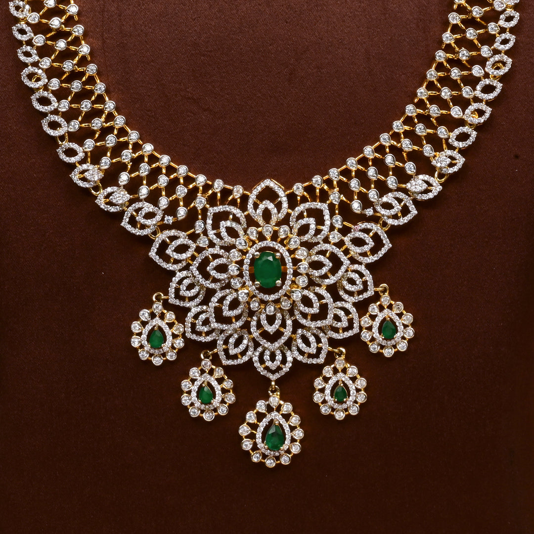 Close-up of Hriday collection of 92.5 silver necklace with CZ stones, intricate floral motifs, and pendant design for bridal and festive wear by Sri Fine Jewellery, Hyderabad.