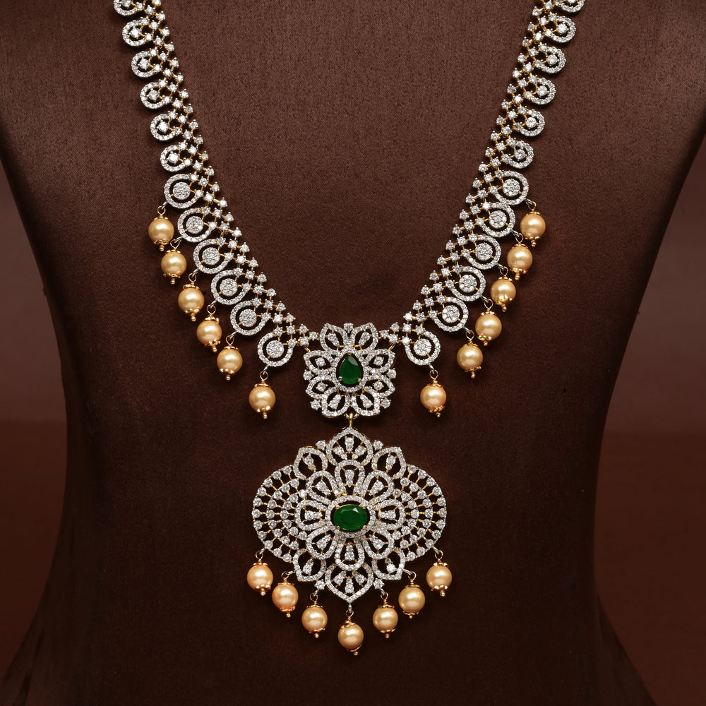 Close-up of Hriday collection of 92.5 silver necklace with CZ stones, intricate floral motifs, and pendant design for bridal and festive wear by Sri Fine Jewellery, Hyderabad.