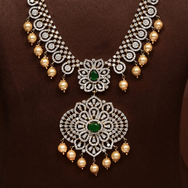 Close-up of Hriday collection of 92.5 silver necklace with CZ stones, intricate floral motifs, and pendant design for bridal and festive wear by Sri Fine Jewellery, Hyderabad.