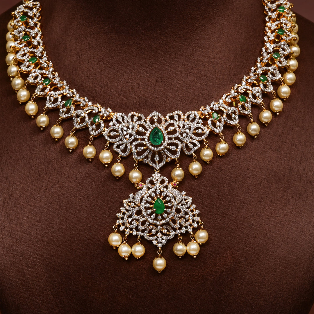 Close-up of Hriday collection of 92.5 silver necklace with CZ stones, intricate floral motifs, and pendant design for bridal and festive wear by Sri Fine Jewellery, Hyderabad.