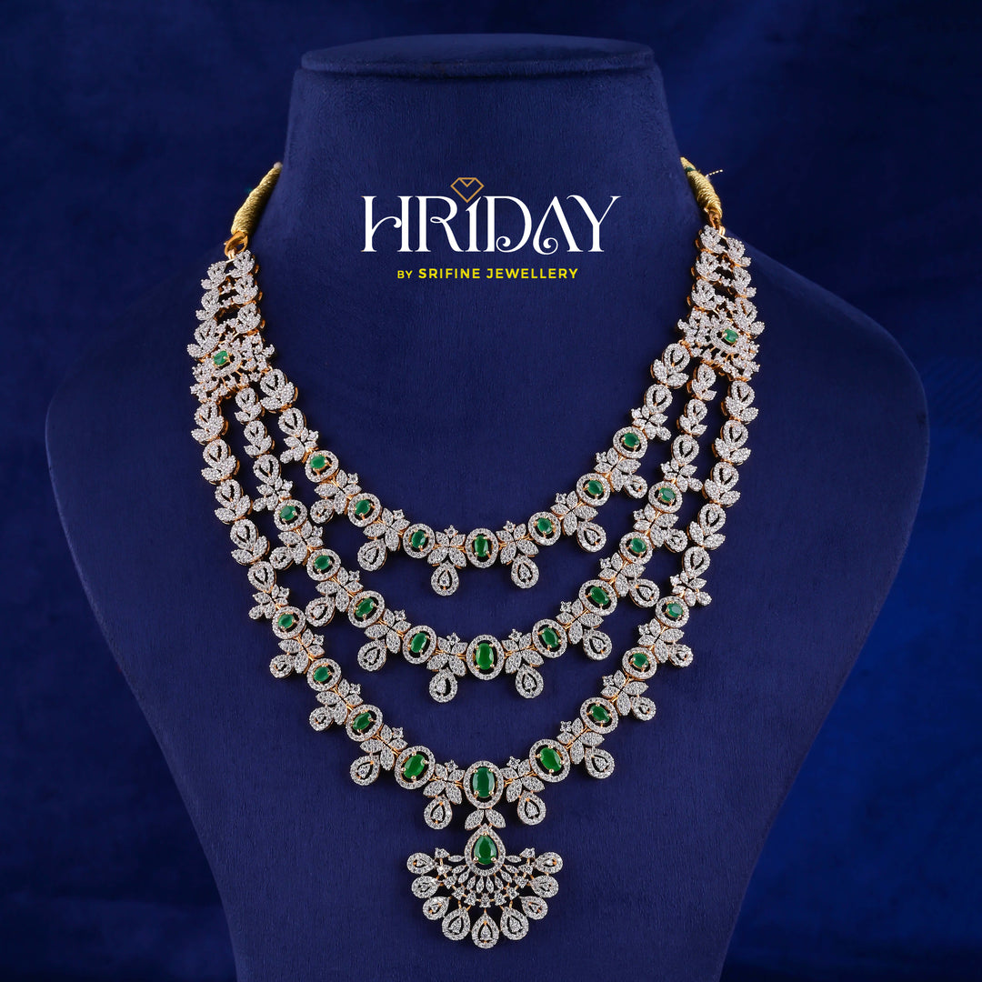 Hriday luxury layered cz emerald necklace in 92.5 silver with emerald green stones, cz diamonds and premium bridal craftsmanship by Sri Fine Jewellery, Hyderabad