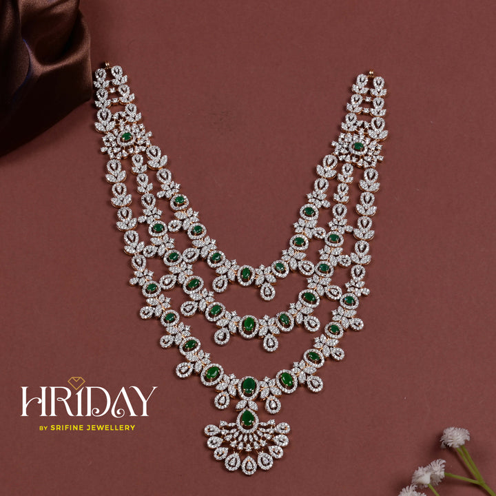 Hriday luxury layered cz emerald necklace in 92.5 silver with emerald green stones, cz diamonds and premium bridal craftsmanship by Sri Fine Jewellery, Hyderabad