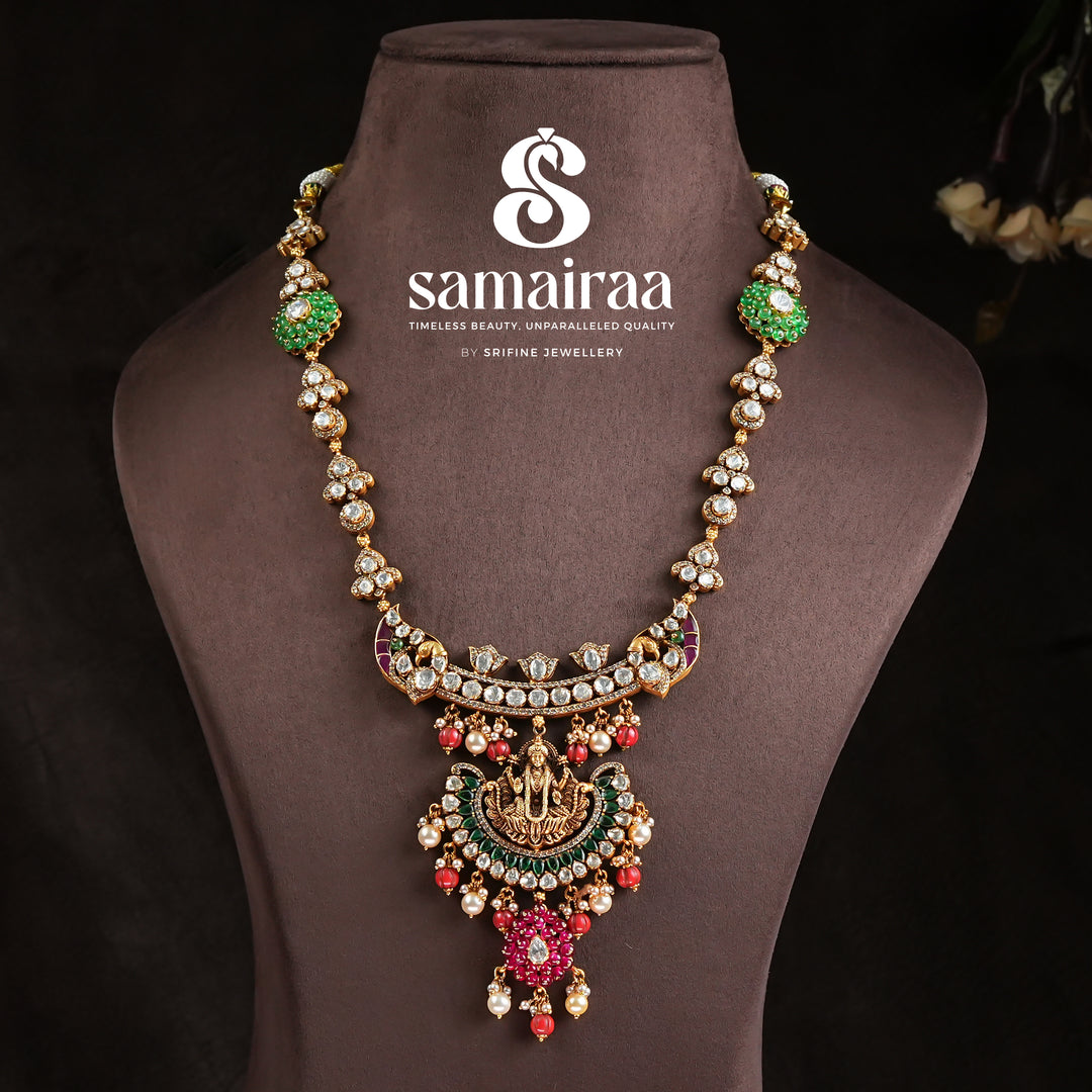 Samairaa antique Lakshmi pendant necklace in 92.5 silver with cz stones, emerald green accents, ruby bead drops and traditional temple craftsmanship by Sri Fine Jewellery, Hyderabad 