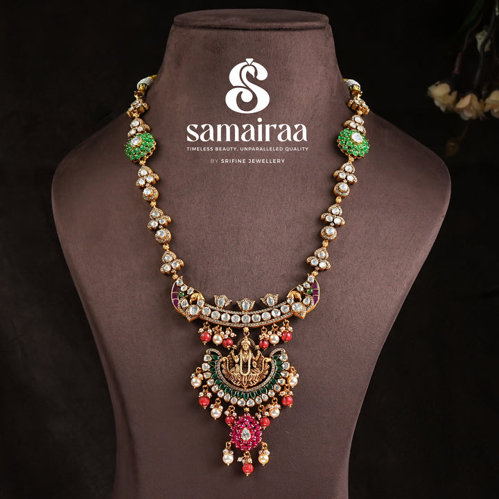 Samairaa antique Lakshmi pendant necklace in 92.5 silver with cz stones, emerald green accents, ruby bead drops and traditional temple craftsmanship by Sri Fine Jewellery, Hyderabad 