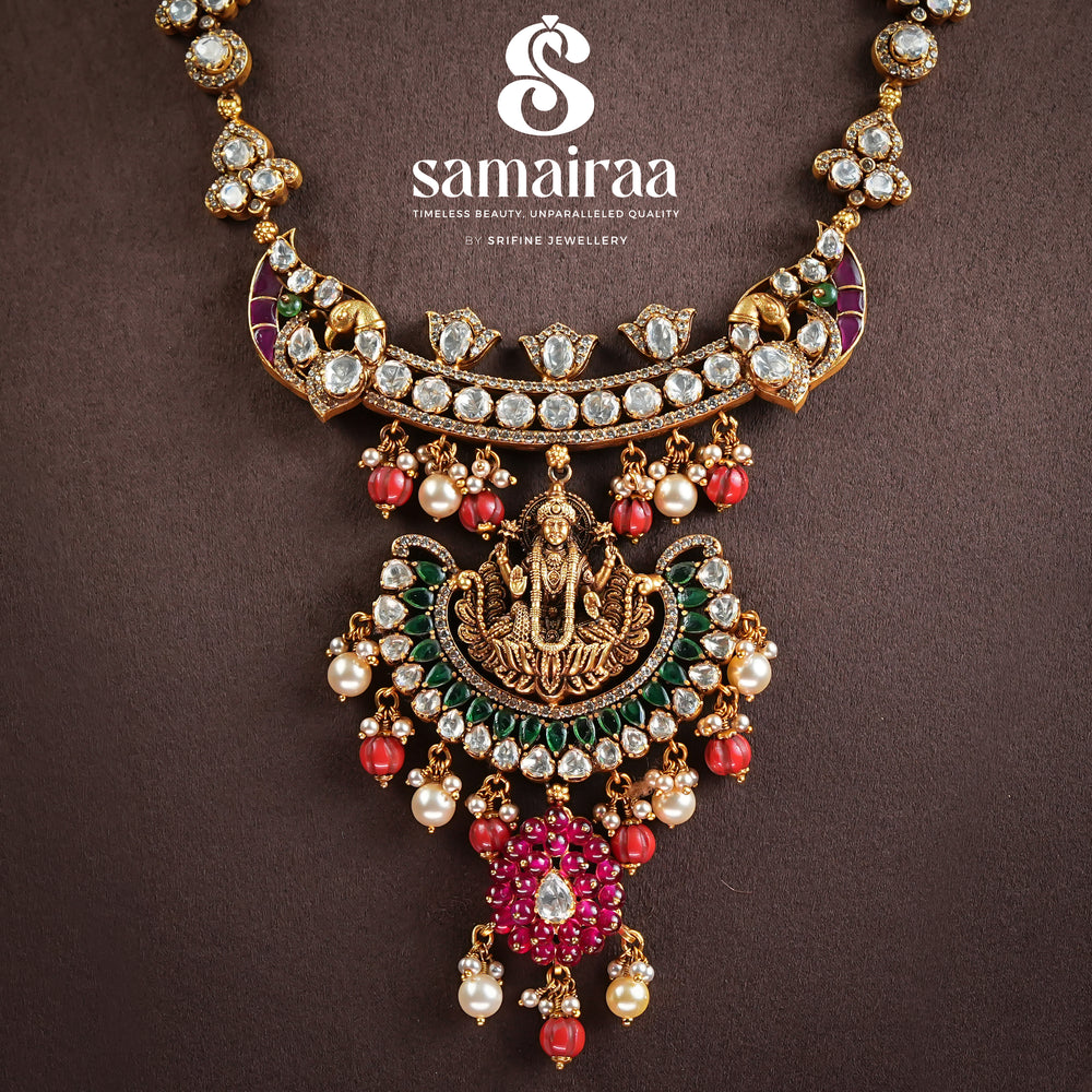 Samairaa antique Lakshmi pendant necklace in 92.5 silver with cz stones, emerald green accents, ruby bead drops and traditional temple craftsmanship by Sri Fine Jewellery, Hyderabad 