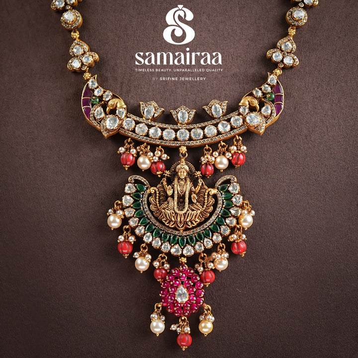 Samairaa antique Lakshmi pendant necklace in 92.5 silver with cz stones, emerald green accents, ruby bead drops and traditional temple craftsmanship by Sri Fine Jewellery, Hyderabad 
