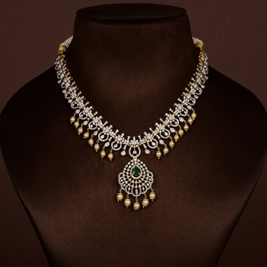 Luxury diamond-look silver cz emerald necklace with premium cz stones, semi-precious emerald stone and  pearl drops in 92.5 silver, bridal wedding jewellery with gold finish by Sri Fine Jewellery Punjagutta Hyderabad.