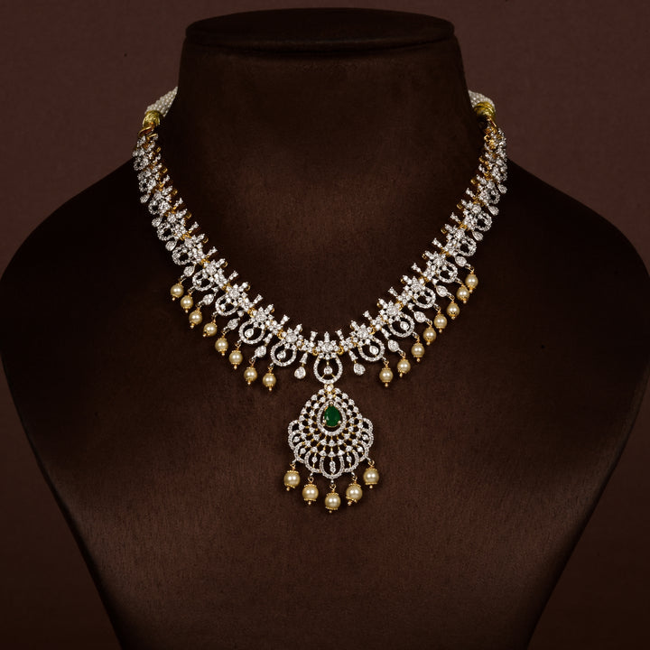Luxury diamond-look silver cz emerald necklace with premium cz stones, semi-precious emerald stone and  pearl drops in 92.5 silver, bridal wedding jewellery with gold finish by Sri Fine Jewellery Punjagutta Hyderabad.