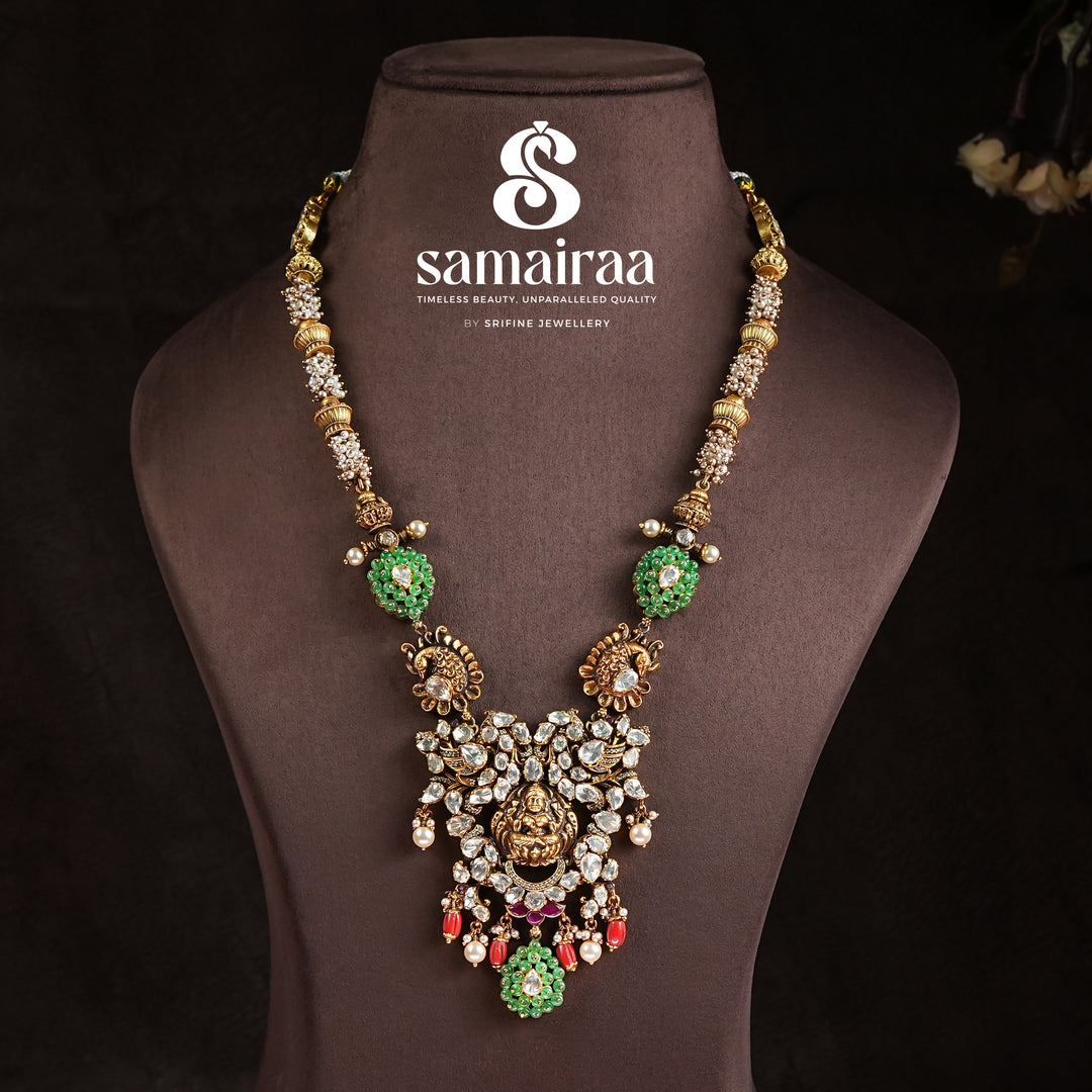 Samairaa traditional temple pendant necklace in 92.5 silver with cz stones, green accents, pearl drops and antique Lakshmi design by Sri Fine Jewellery, Hyderabad
