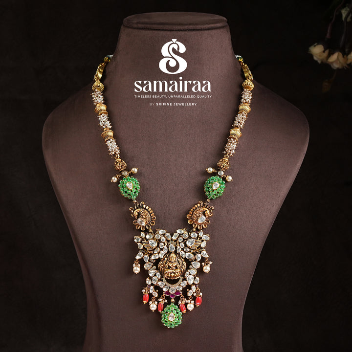 Samairaa traditional temple pendant necklace in 92.5 silver with cz stones, green accents, pearl drops and antique Lakshmi design by Sri Fine Jewellery, Hyderabad