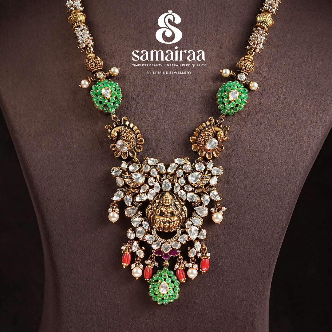 Samairaa traditional temple pendant necklace in 92.5 silver with cz stones, green accents, pearl drops and antique Lakshmi design by Sri Fine Jewellery, Hyderabad