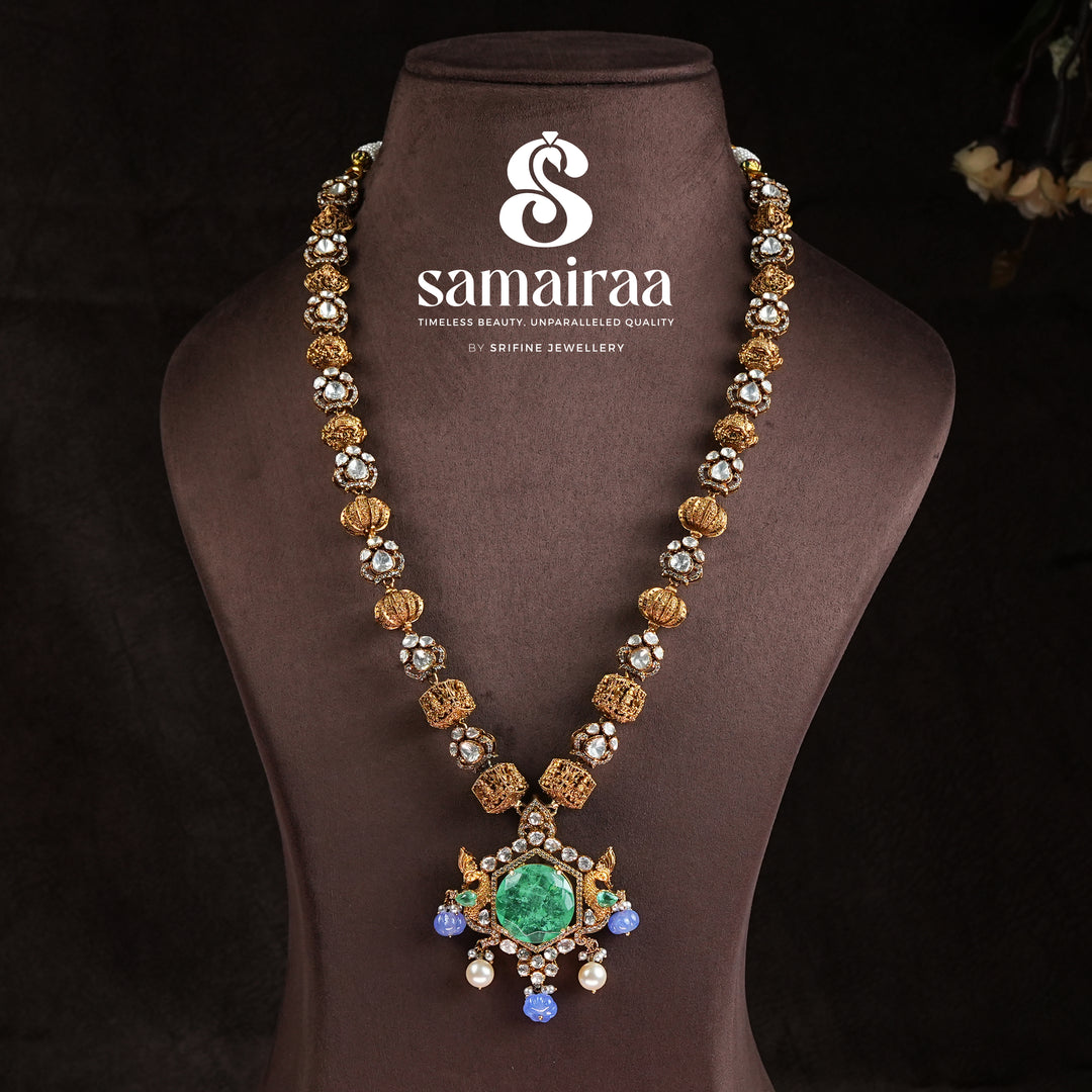 Samairaa long heritage necklace in 92.5 sterling silver with cz stones, antique gold finish, emerald green pendant and pearl drops by Sri Fine Jewellery, Hyderabad 