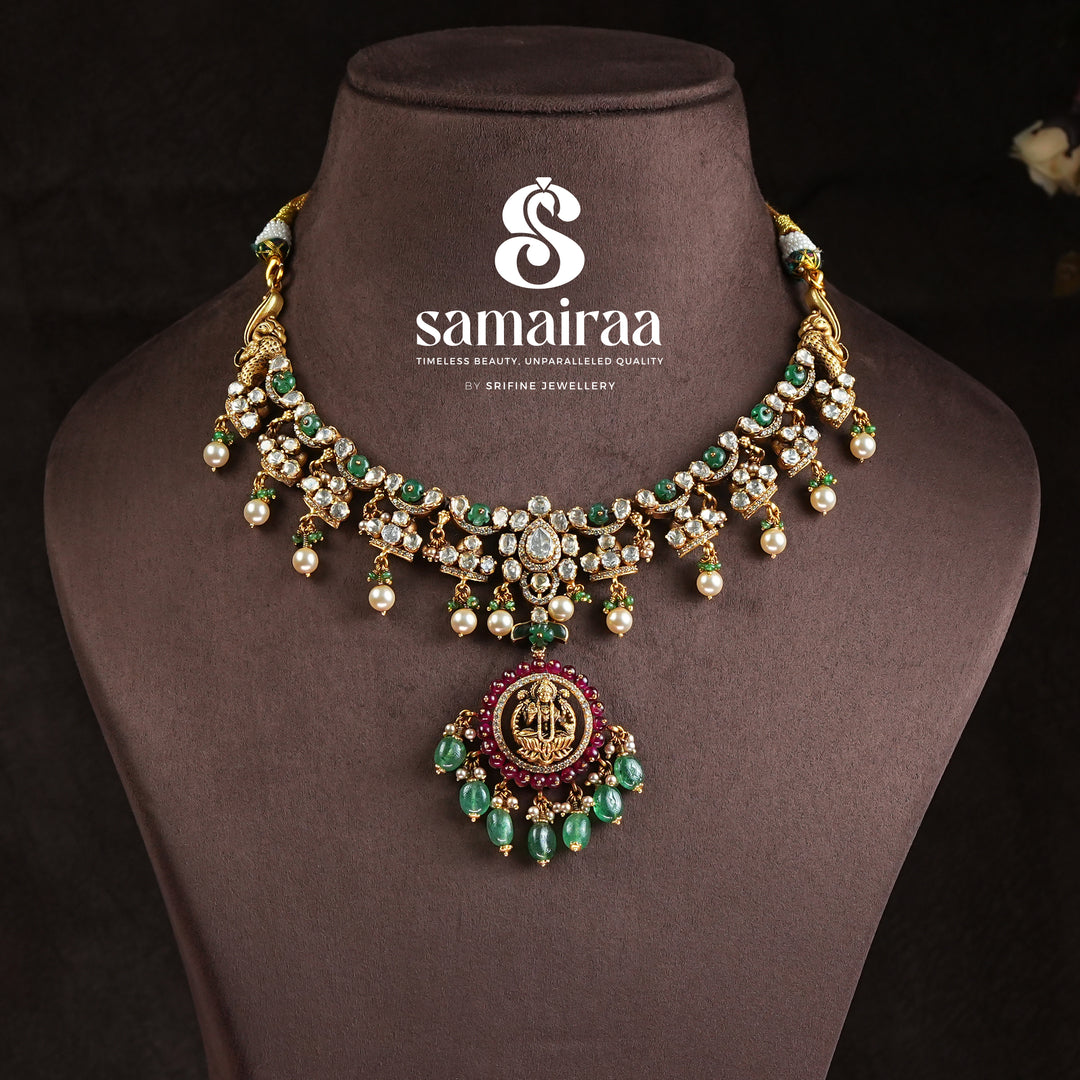Samairaa traditional temple necklace in 92.5 silver with cz stones, emerald green beads, pearl drops and antique gold finish pendant by Sri Fine Jewellery, Hyderabad