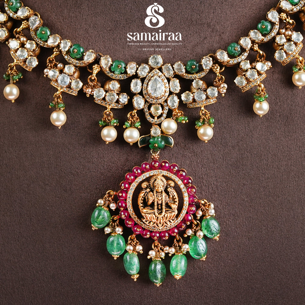 Samairaa traditional temple necklace in 92.5 silver with cz stones, emerald green beads, pearl drops and antique gold finish pendant by Sri Fine Jewellery, Hyderabad
