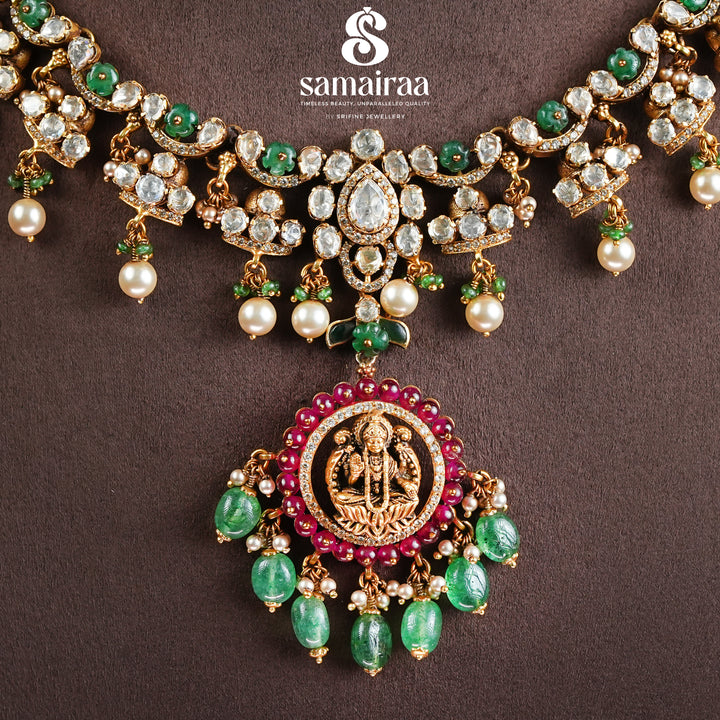 Samairaa traditional temple necklace in 92.5 silver with cz stones, emerald green beads, pearl drops and antique gold finish pendant by Sri Fine Jewellery, Hyderabad