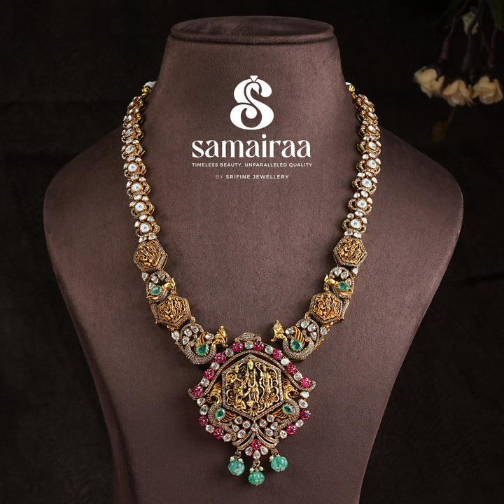 Samairaa temple necklace in 92.5 silver with Ram parivar pendant, ruby emerald stones, peacock motifs and antique South Indian bridal jewellery design by Sri Fine Jewellery, Hyderabad
