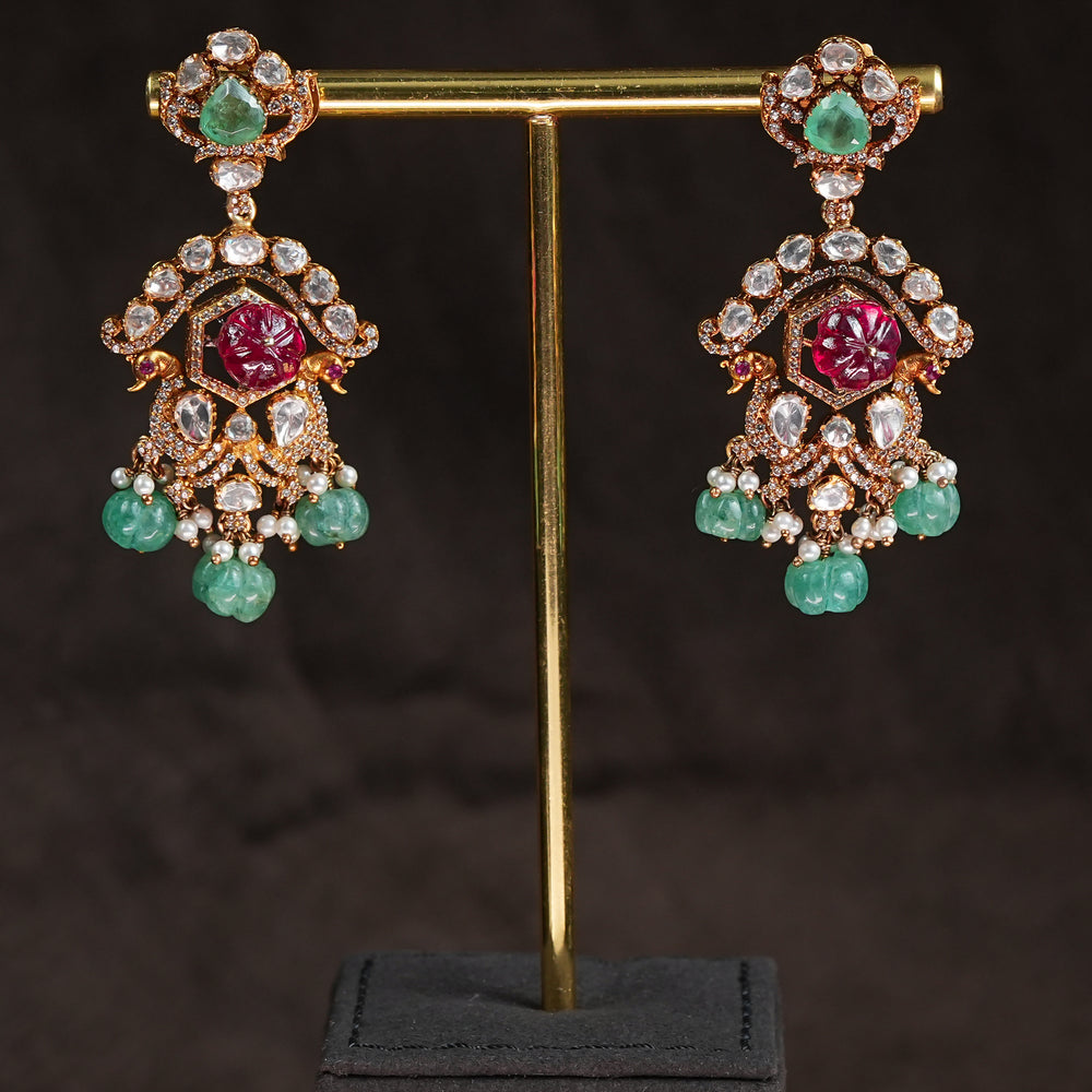Samairaa temple earrings in 92.5 silver with Lakshmi pendant, ruby emerald stones, peacock motifs and antique South Indian bridal jewellery design by Sri Fine Jewellery, Hyderabad