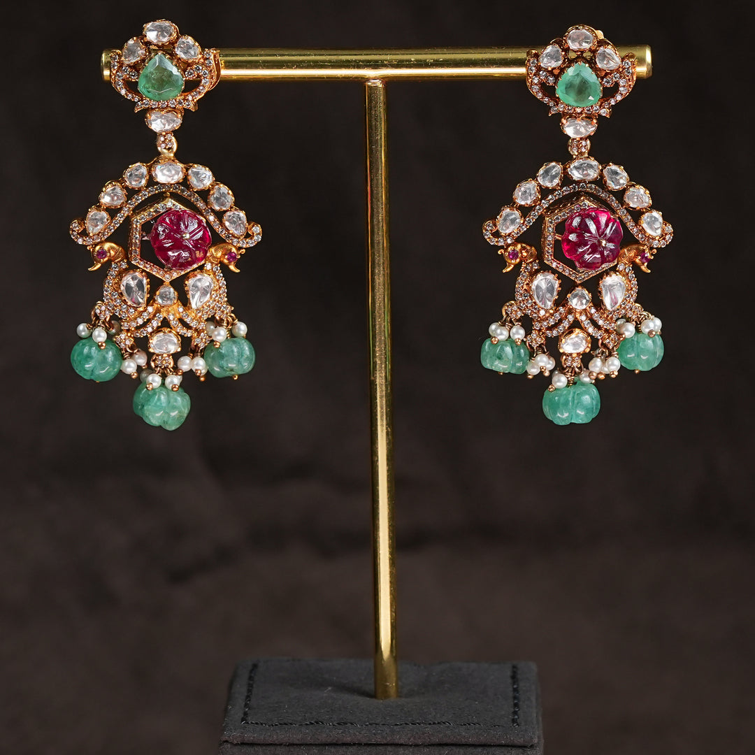 Samairaa temple earrings in 92.5 silver with Lakshmi pendant, ruby emerald stones, peacock motifs and antique South Indian bridal jewellery design by Sri Fine Jewellery, Hyderabad