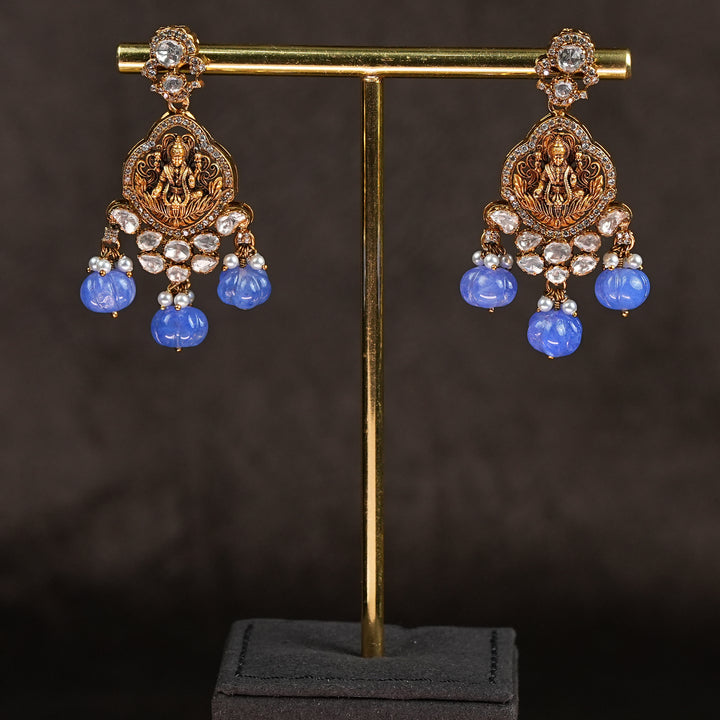 Samairaa temple long earrings in 92.5 silver with Lakshmi pendant, antique gold finish, cz stones and traditional South Indian bridal jewellery design by Sri Fine Jewellery, Hyderabad
