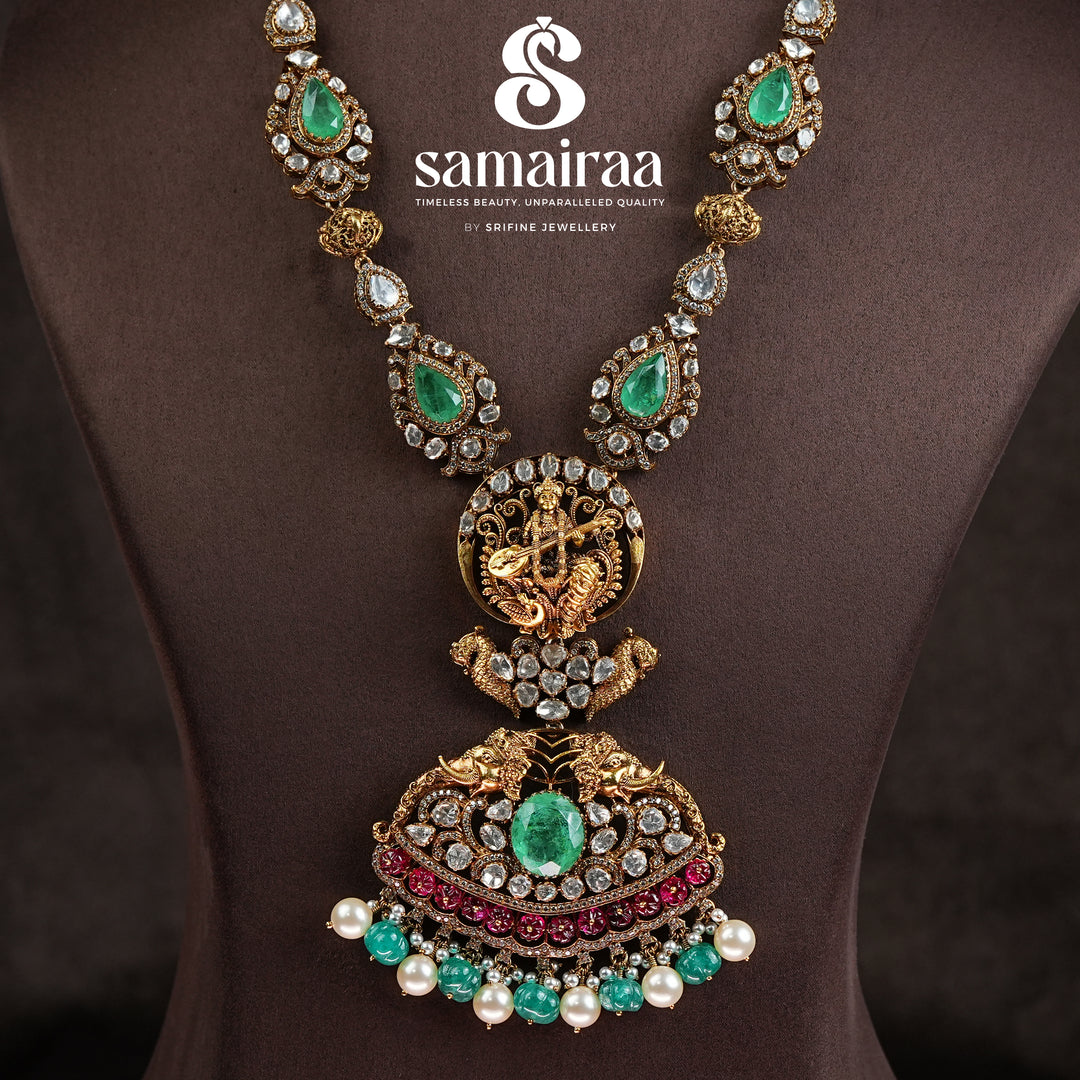 Samairaa temple necklace in 92.5 silver with Lakshmi pendant, peacock motifs, ruby emerald stones and antique bridal jewellery design by Sri Fine Jewellery, Hyderabad.
