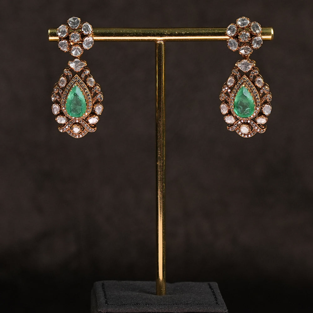 Samairaa temple earrings in 92.5 silver with Lakshmi pendant, peacock motifs, emerald stones and antique bridal jewellery design by Sri Fine Jewellery, Hyderabad.

