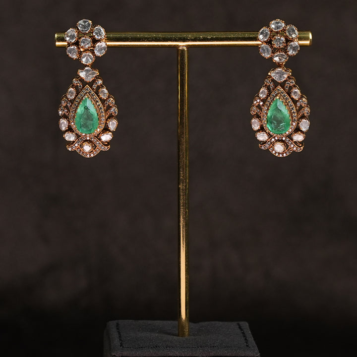 Samairaa temple earrings in 92.5 silver with Lakshmi pendant, peacock motifs, emerald stones and antique bridal jewellery design by Sri Fine Jewellery, Hyderabad.
