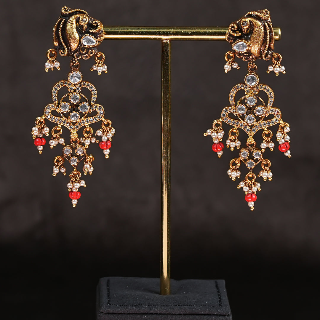 Samairaa temple earrings in 92.5 silver with Lakshmi pendant, peacock motifs, ruby emerald stones and antique bridal jewellery design by Sri Fine Jewellery, Hyderabad.

