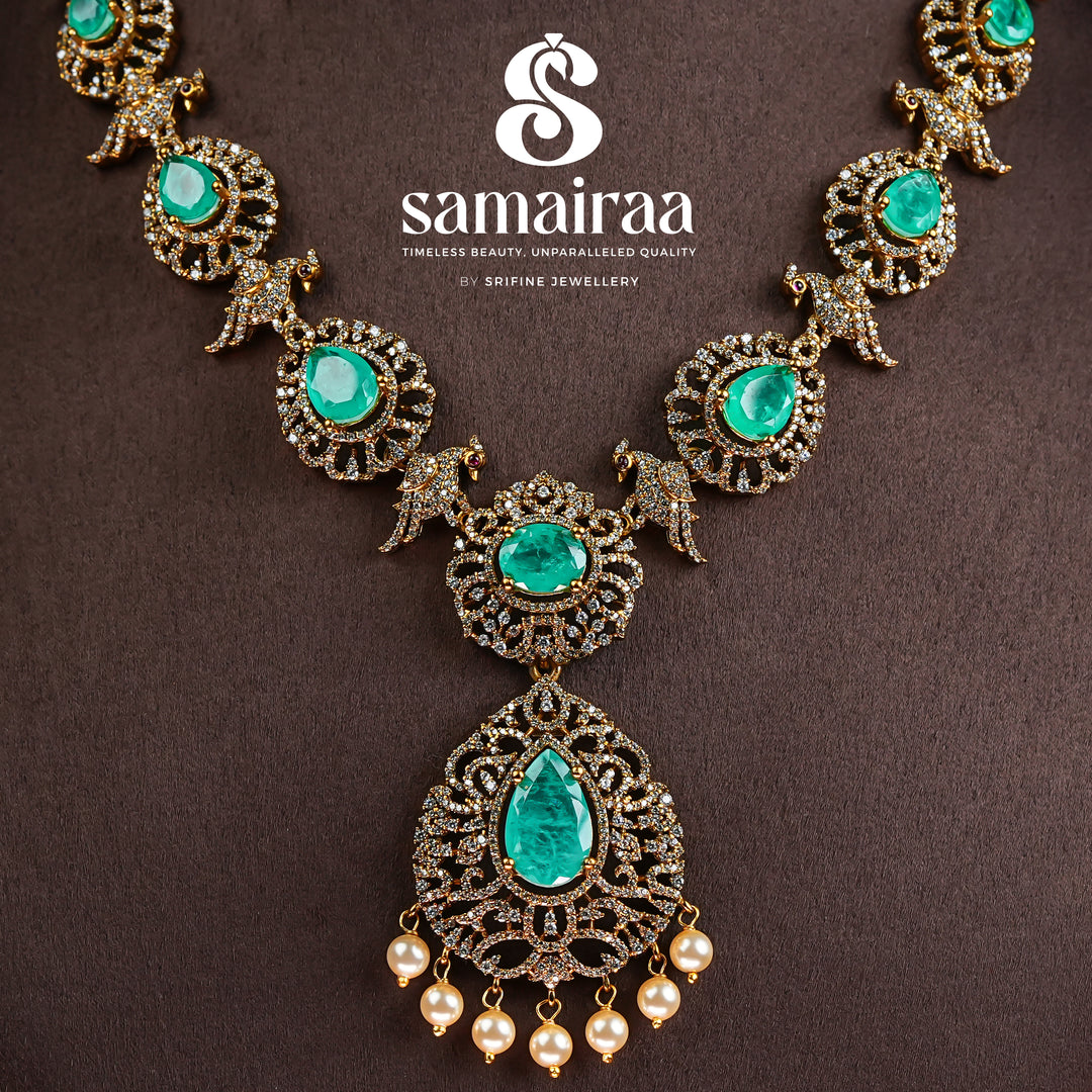 Samairaa emerald green victorian necklace in 92.5 silver with antique gold finish, cz stones, pearl drops and elegant bridal jewellery design by Sri Fine Jewellery, Hyderabad