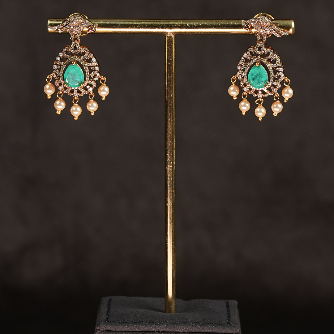 Samairaa emerald green victorian earrings in 92.5 silver with antique gold finish, cz stones, pearl drops and elegant bridal jewellery design by Sri Fine Jewellery, Hyderabad