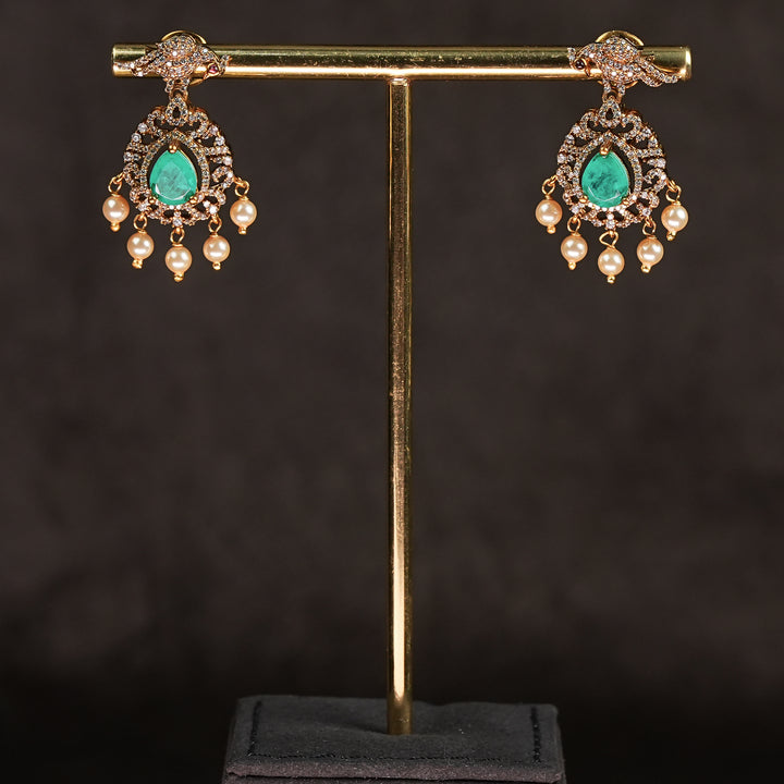 Samairaa emerald green victorian earrings in 92.5 silver with antique gold finish, cz stones, pearl drops and elegant bridal jewellery design by Sri Fine Jewellery, Hyderabad