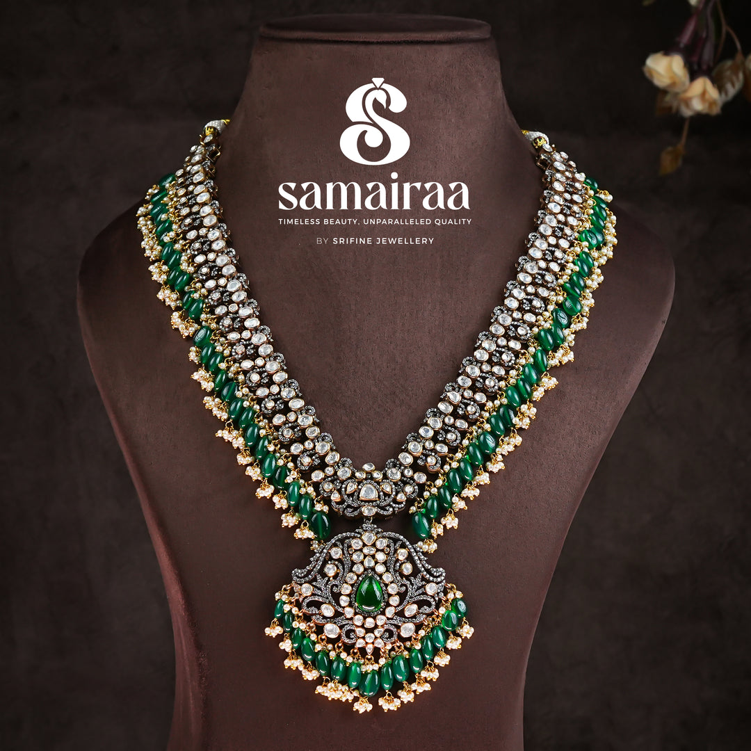 Samairaa emerald green victorian long necklace in 92.5 silver with diamond-like stones, antique finish and luxurious bridal heritage jewellery design by Sri Fine Jewellery, Hyderabad. 
