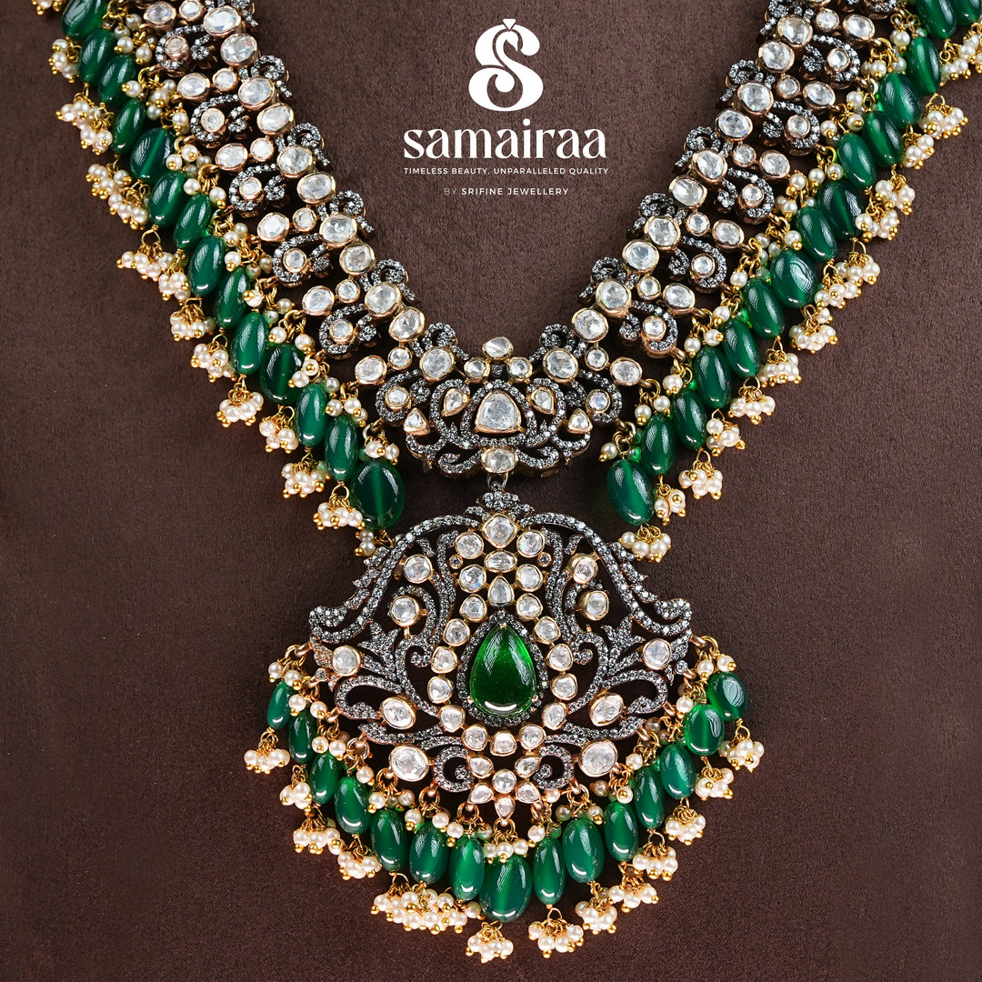 Samairaa emerald green victorian long necklace in 92.5 silver with diamond-like stones, antique finish and luxurious bridal heritage jewellery design by Sri Fine Jewellery, Hyderabad.
