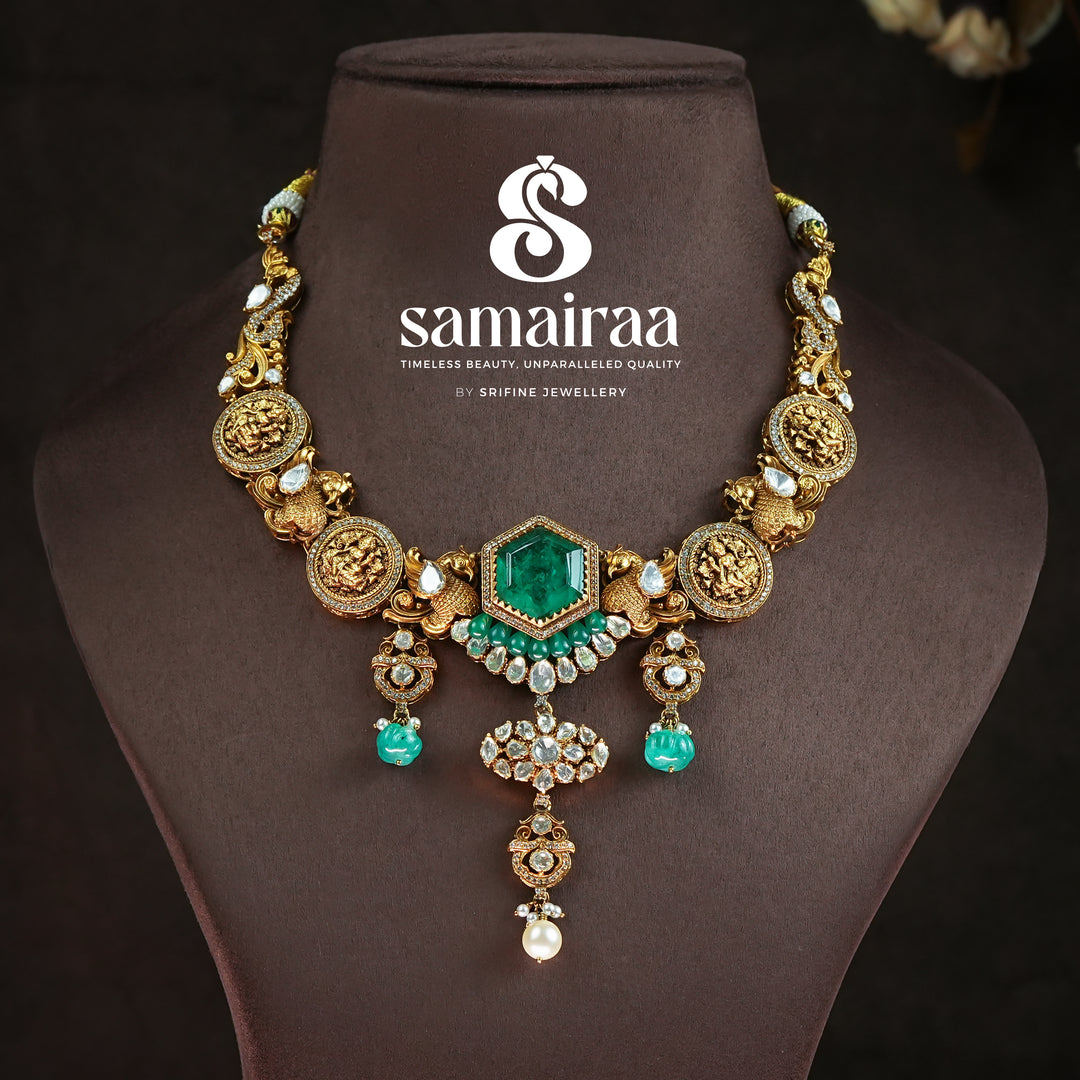 Samairaa antique coin necklace in 92.5 silver with emerald green center stone, Lakshmi coin motifs, pearl drops and cz detailing | premium temple bridal jewellery by Sri Fine Jewellery, Hyderabad
